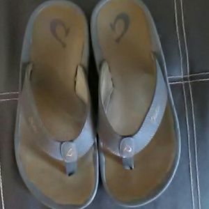 Men's brown Olukai flip flops with memory foam